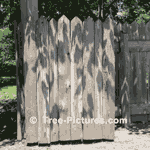 Rustic Cedar Tree Fence made from Rough Cut Cedars with Bark Left on